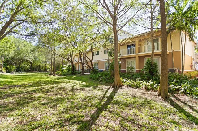 a swimming pool with outdoor seating and yard