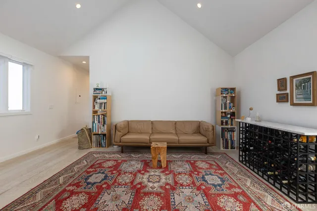a living room with furniture and a rug