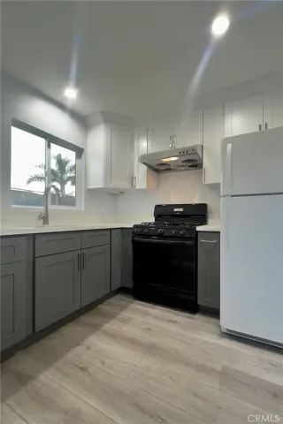 a kitchen with a sink and a stove