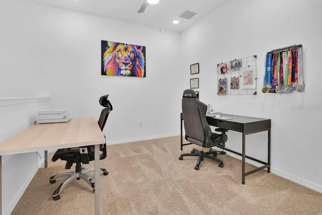 a view of a workspace with furniture