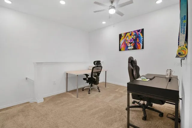 a view of a workspace with furniture