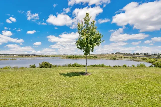 a view of a lake with a big yard