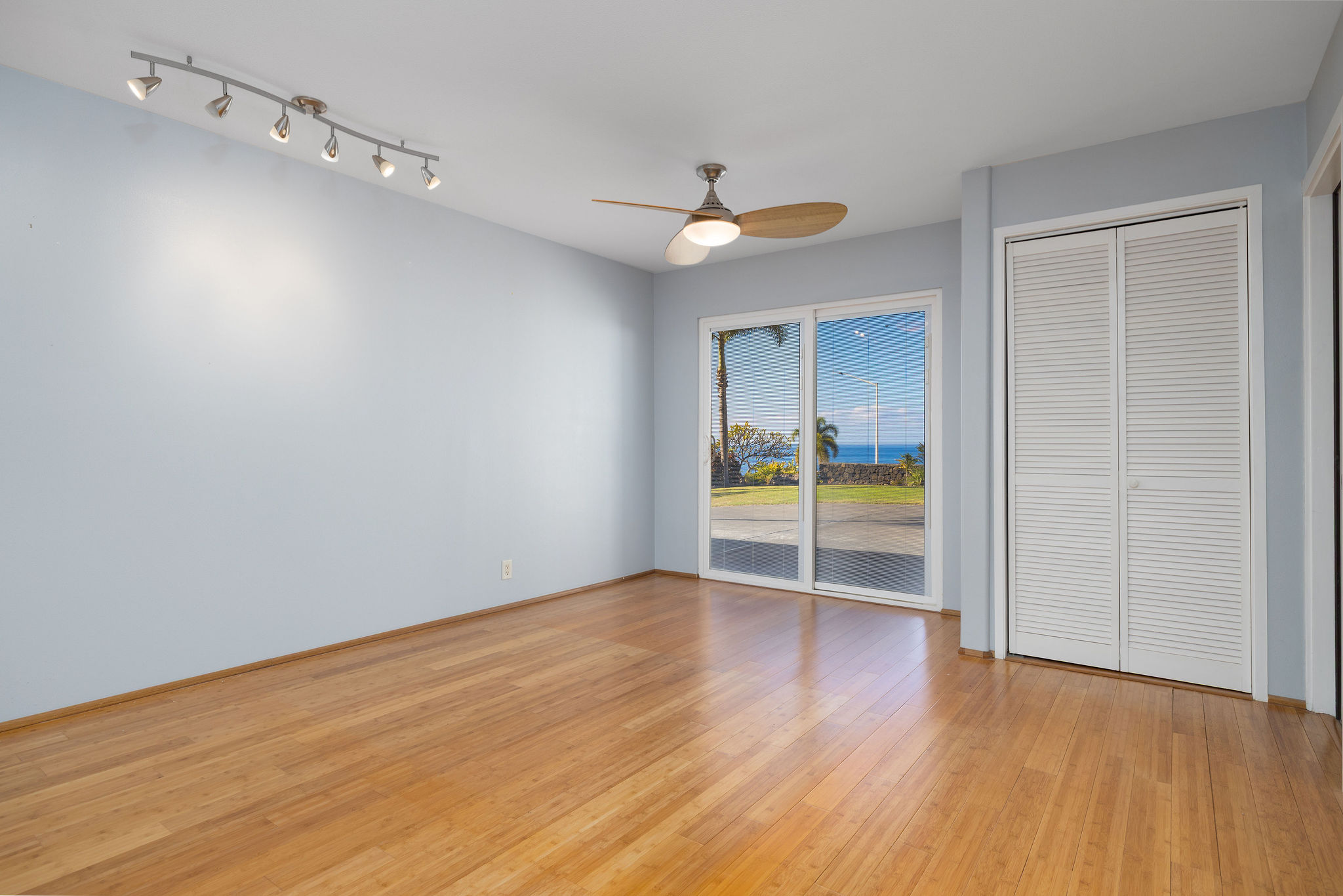 77-267 Hoomohala Road Kailua-Kona, HI 96740 - Photo 17 of 30 a view of an empty room with wooden floor and fan