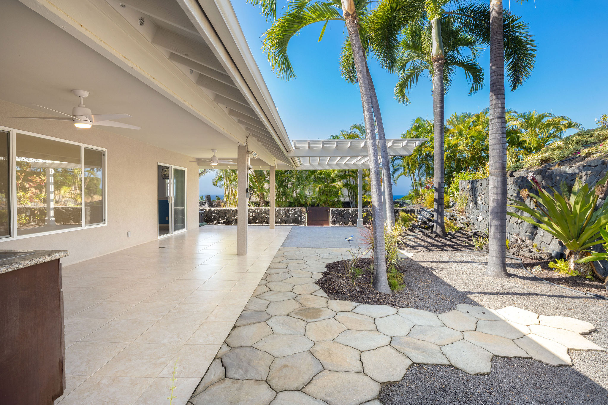 77-267 Hoomohala Road Kailua-Kona, HI 96740 - Photo 3 of 30 a view of a patio with a yard