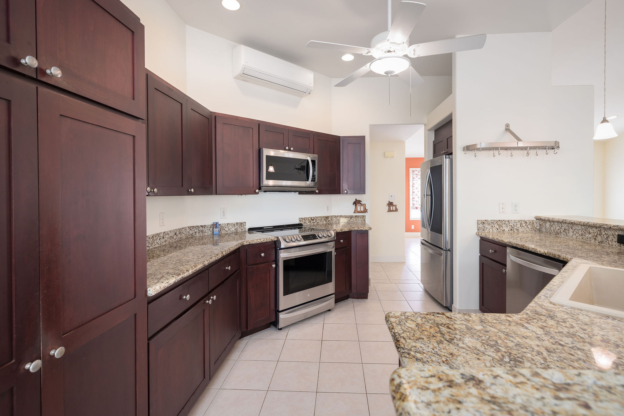 77-267 Hoomohala Road Kailua-Kona, HI 96740 - Photo 7 of 30 a kitchen with stainless steel appliances granite countertop a stove top oven a sink and dishwasher