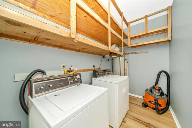 an empty room with closet and windows