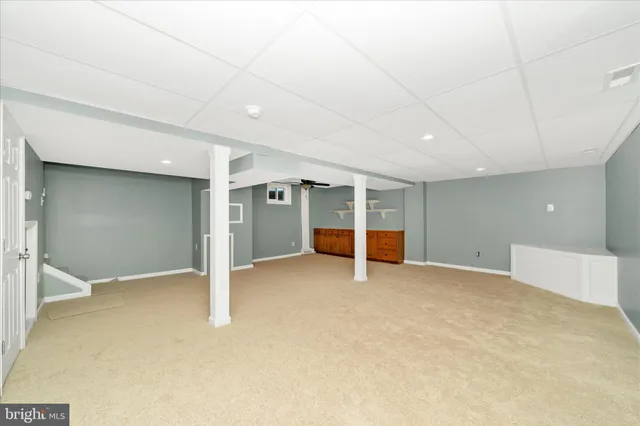 a view of yard with large trees