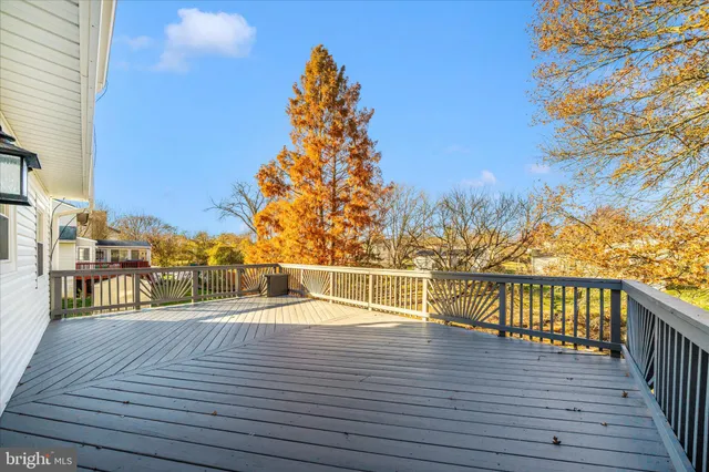 a view of balcony and deck with wooden floor and fence