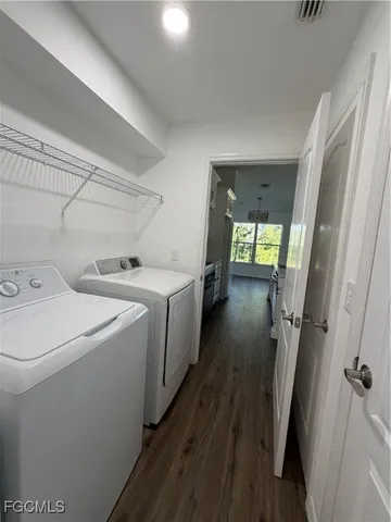 a living room with furniture and a mirror