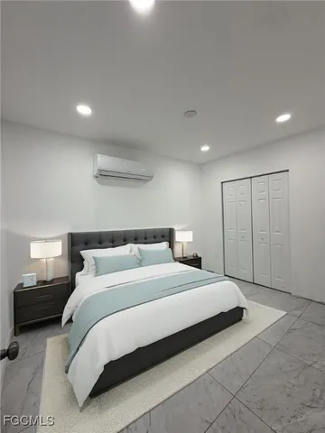 a bathroom with a granite countertop sink a toilet and a mirror