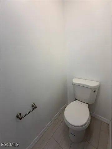 a bedroom with a large bed and a flat tv screen on a dresser