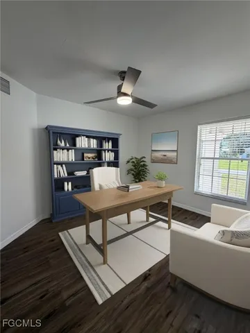 a living room with furniture a rug and a window