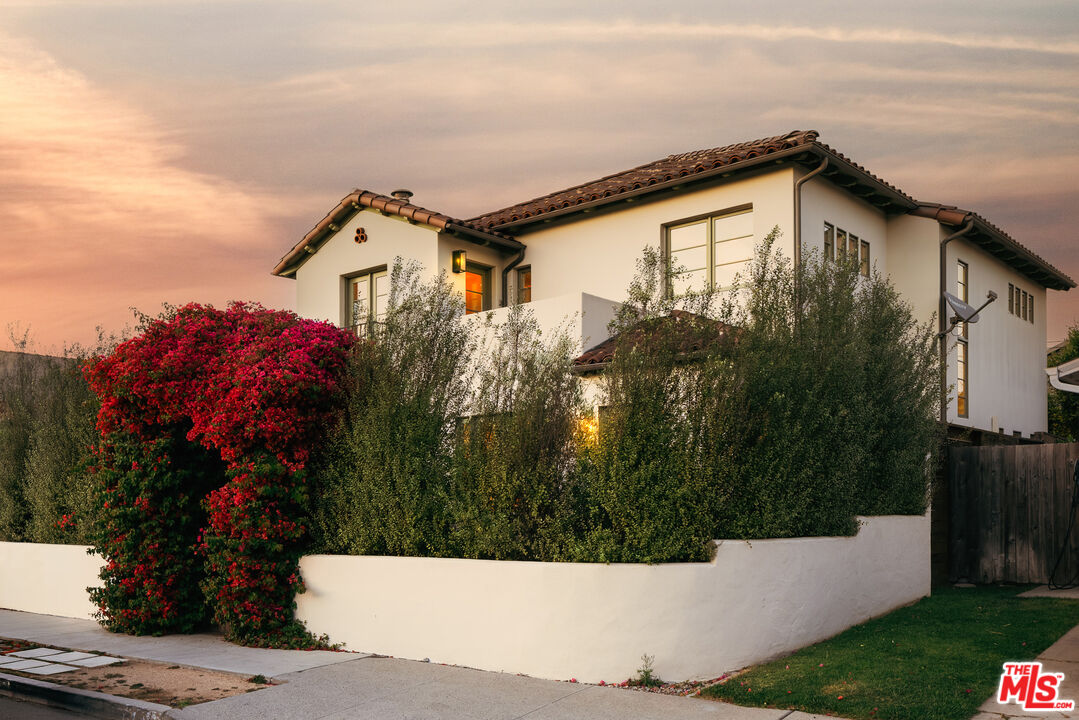 a view of a house with a small yard