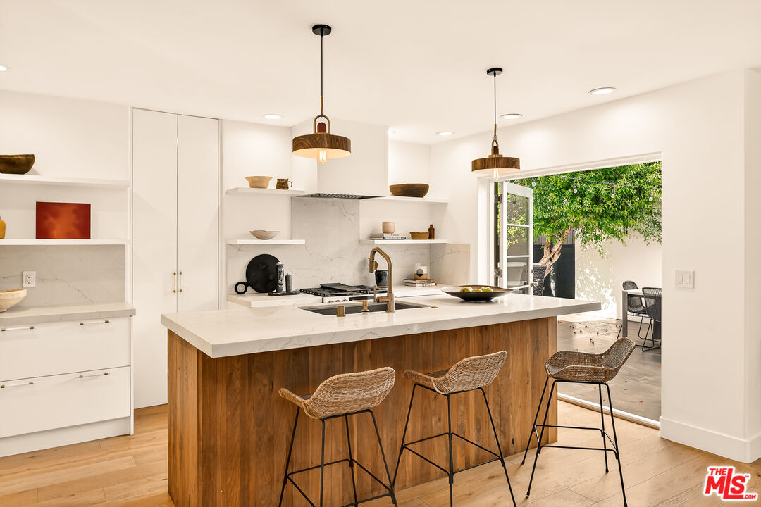 3128 Stanford Avenue Venice, CA 90292 - Photo 11 of 43 a view of a kitchen area with furniture and wooden floor