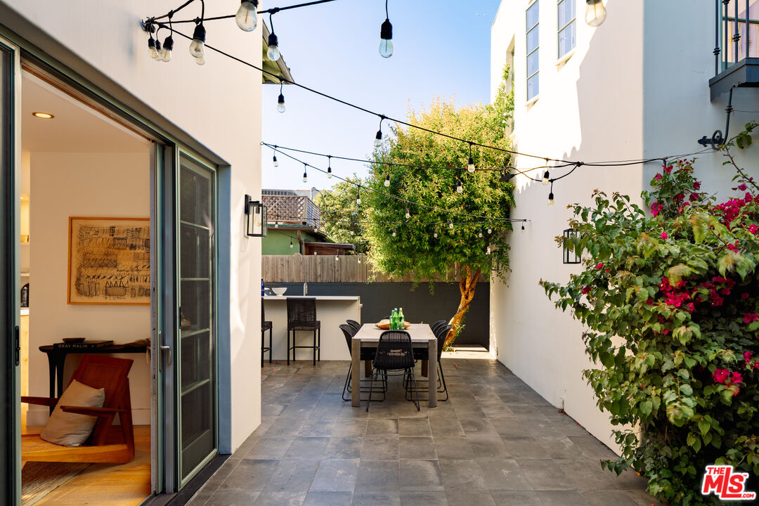 3128 Stanford Avenue Venice, CA 90292 - Photo 16 of 43 a view of a patio with table and chairs and potted plants