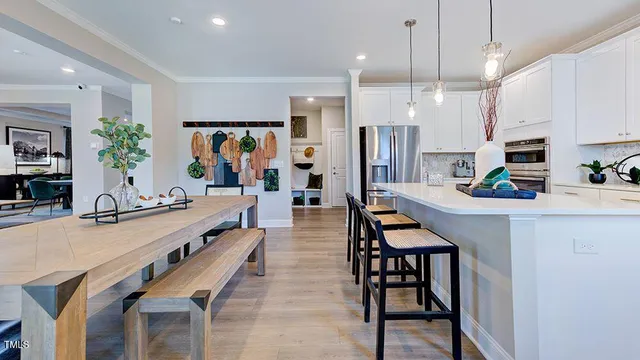 a living room with furniture a piano and a flat screen tv