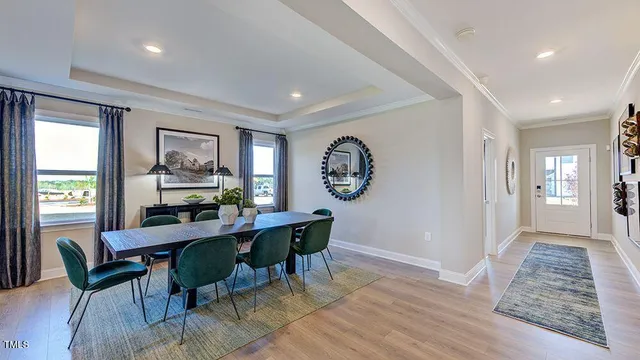 a living room with furniture kitchen view and a dining table