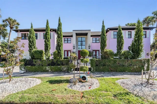 a view of a house with swimming pool and garden