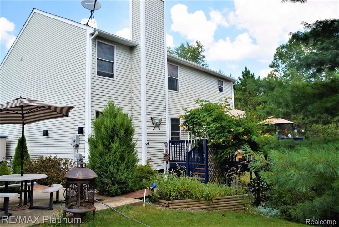 17033 Rosehill Road Pinckney, MI 48169 - Photo 15 of 17 back patio.jpg