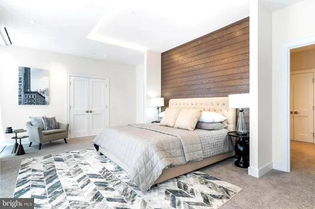 a bedroom with a bed and a couch