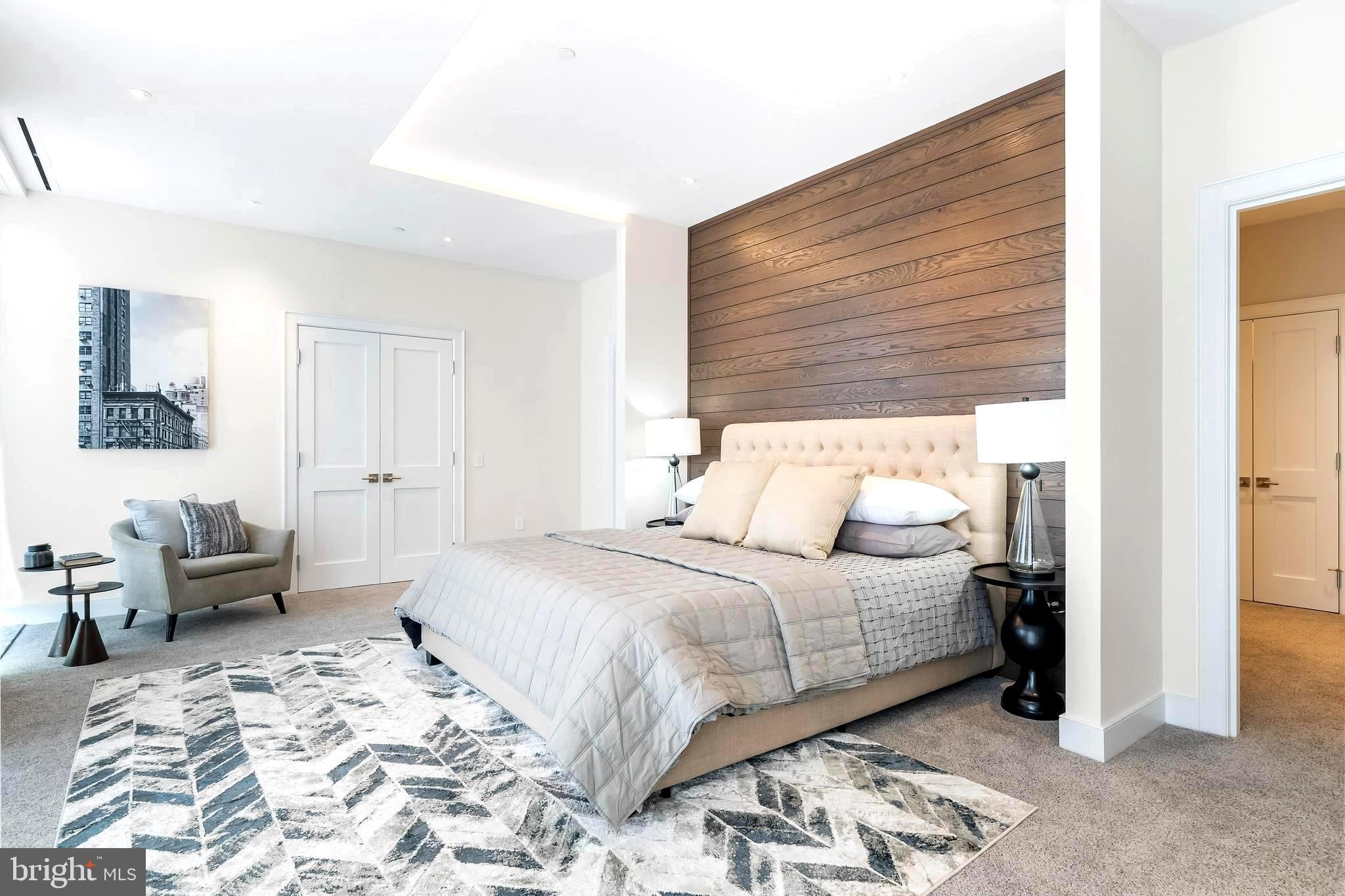 1600 Arch Street, Unit 1621 Philadelphia, PA 19103 - Photo 20 of 46 a bedroom with a bed and a couch