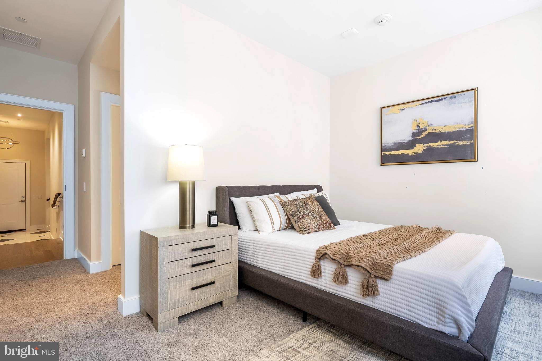 1600 Arch Street, Unit 1621 Philadelphia, PA 19103 - Photo 24 of 46 a bedroom with a bed and a painting