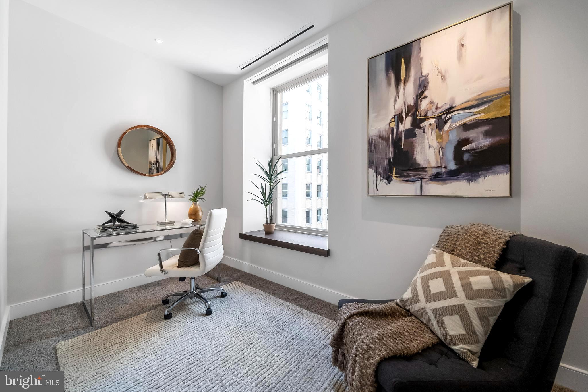 1600 Arch Street, Unit 1621 Philadelphia, PA 19103 - Photo 26 of 46 a living room with furniture and a window