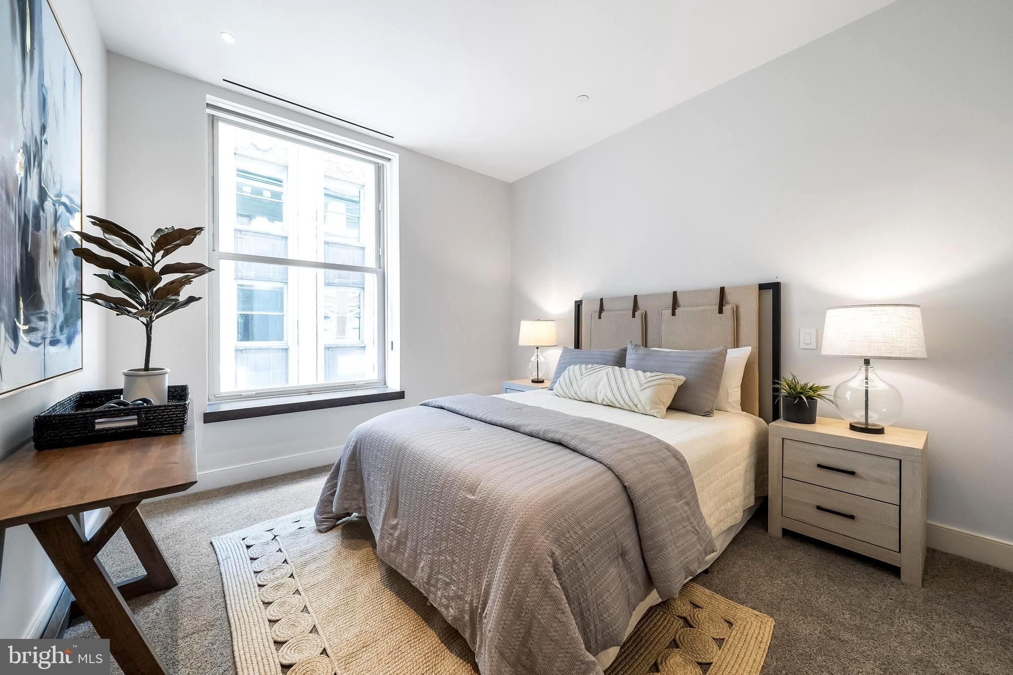 1600 Arch Street, Unit 1621 Philadelphia, PA 19103 - Photo 28 of 46 a bedroom with a bed and a window