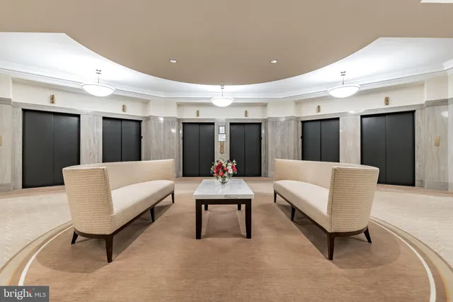 a living room with furniture and white walls