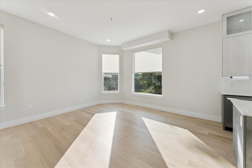 1512 Seegar Street, Unit 101 Dallas, TX 75215 - Photo 15 of 31 an empty room with windows