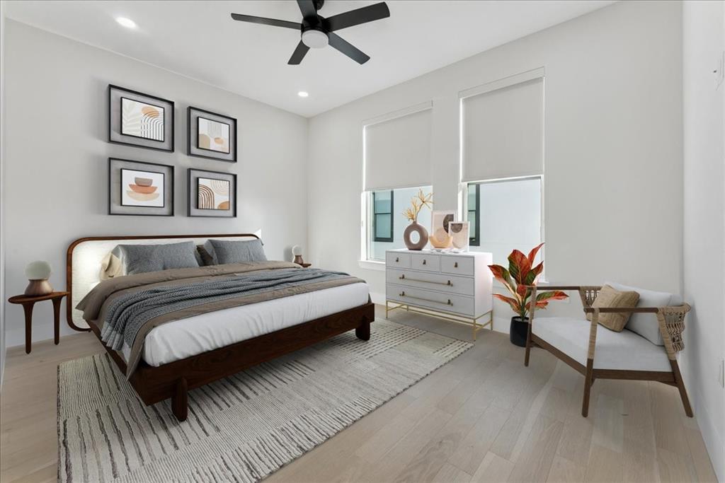 1512 Seegar Street, Unit 101 Dallas, TX 75215 - Photo 21 of 31 a bedroom with a bed and a chandelier