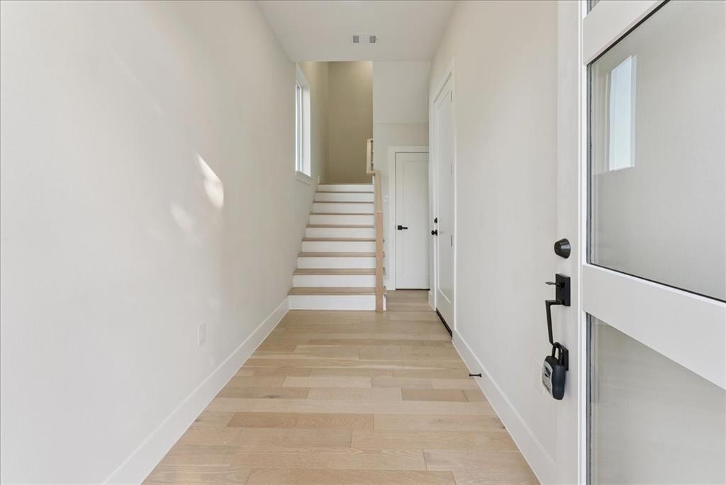 1512 Seegar Street, Unit 101 Dallas, TX 75215 - Photo 3 of 31 a view of a hallway with staircase