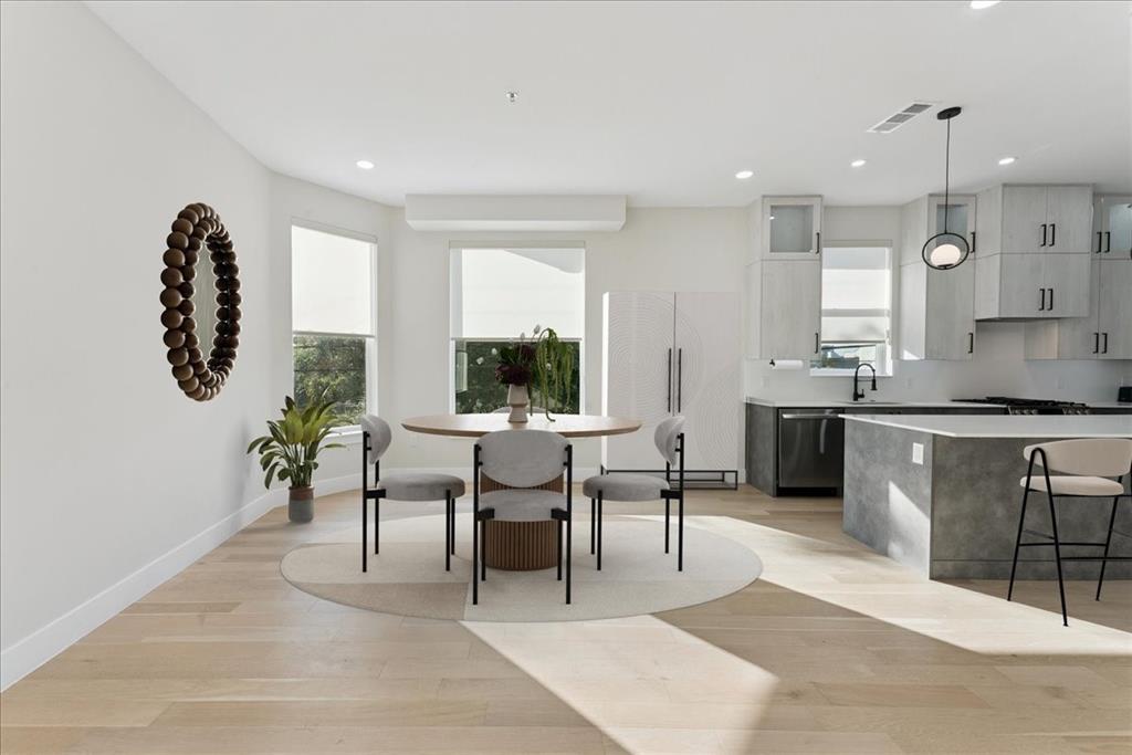 1512 Seegar Street, Unit 101 Dallas, TX 75215 - Photo 7 of 31 a living room with granite countertop furniture a rug kitchen view and a large window