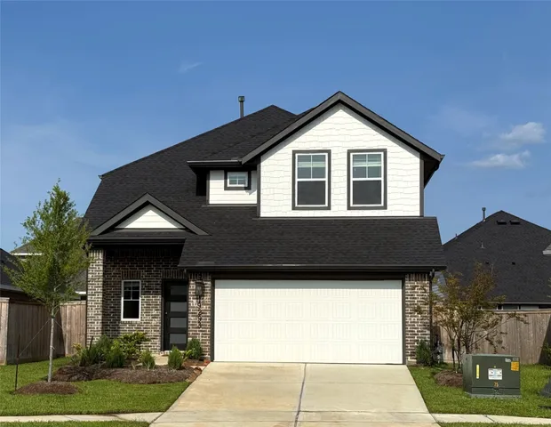 a front view of a house with yard
