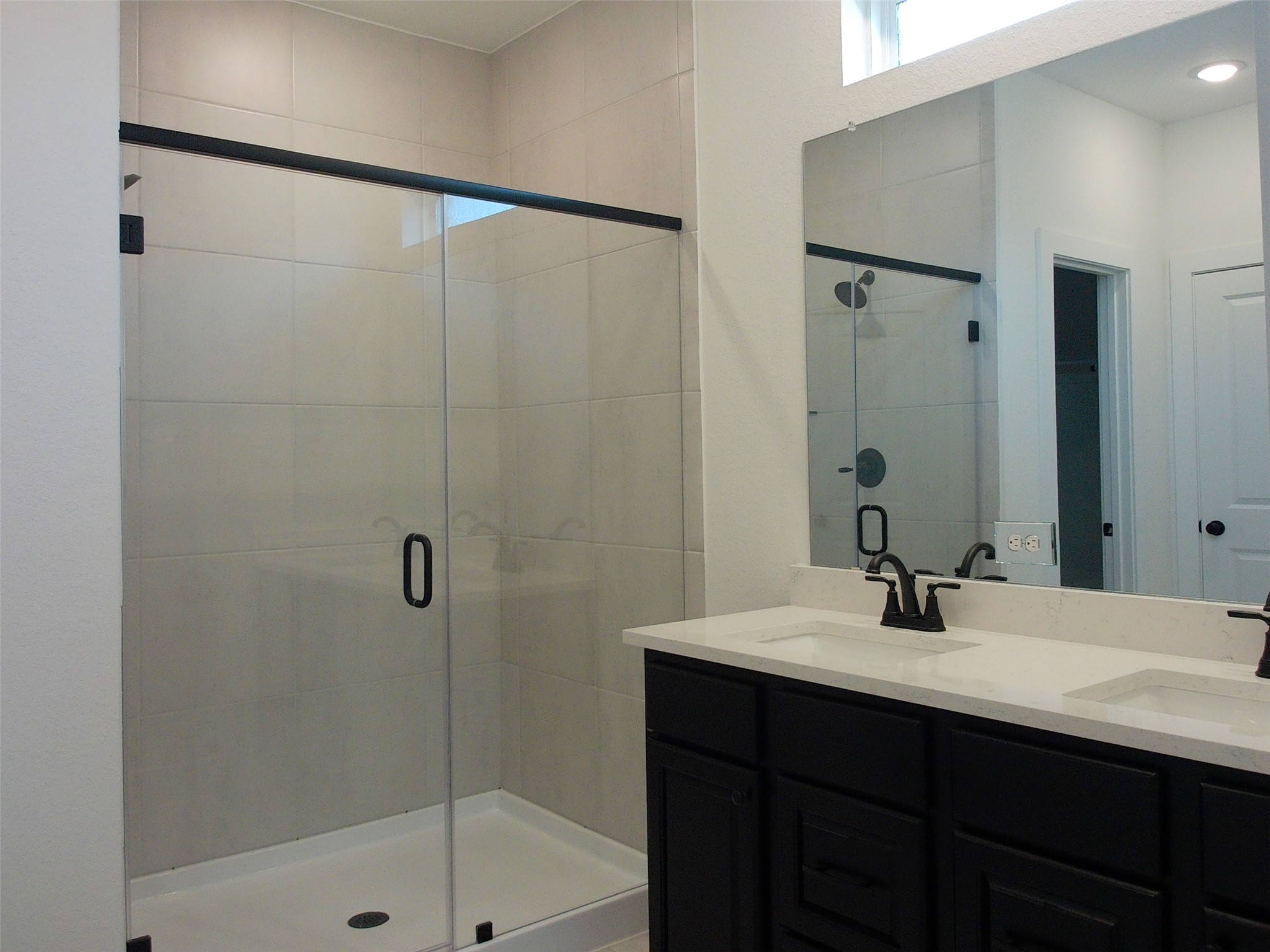 19293 Hazel Firs Court Magnolia, TX 77355 - Photo 13 of 36 a bathroom with a sink and a mirror