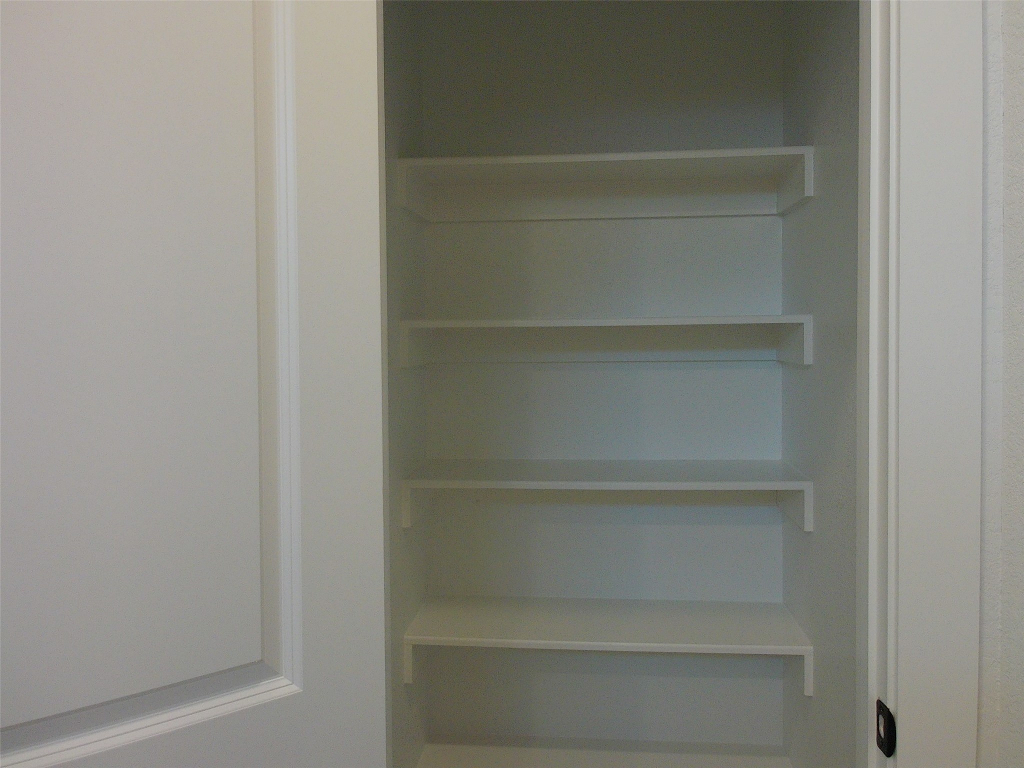 19293 Hazel Firs Court Magnolia, TX 77355 - Photo 15 of 36 a view of walk in closet with empty racks