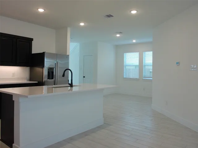 a view of a kitchen with a sink and dishwasher