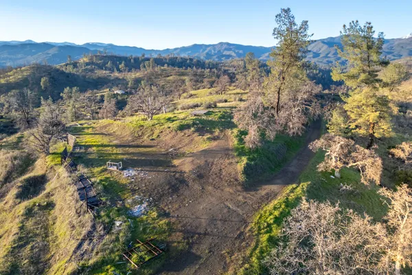 a view of a town with mountains in the background