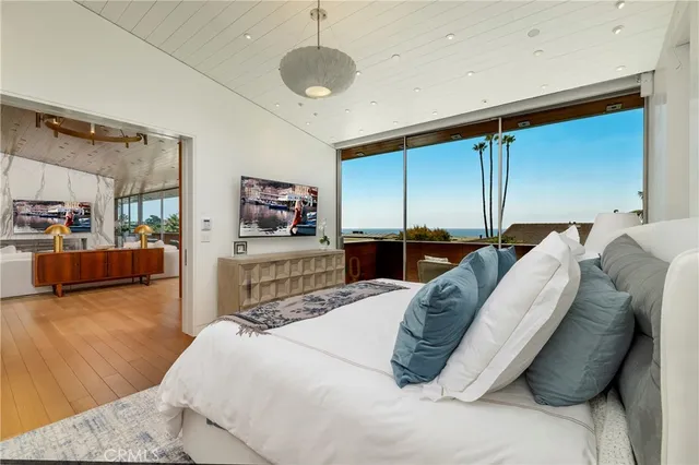 a bed room with a bed window and dresser