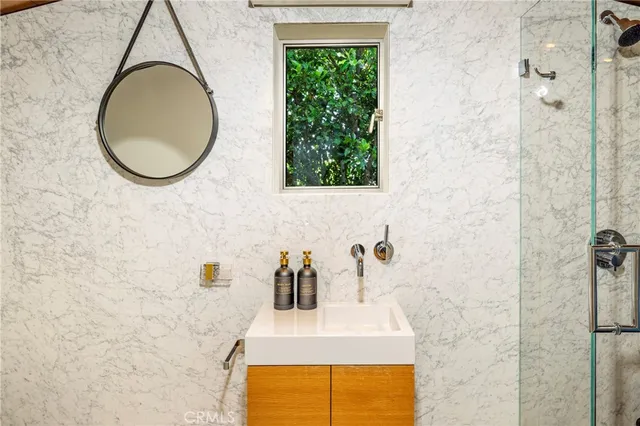 a bathroom with a sink and a mirror