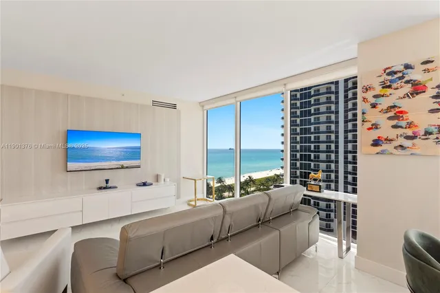 a living room with furniture white walls and white walls