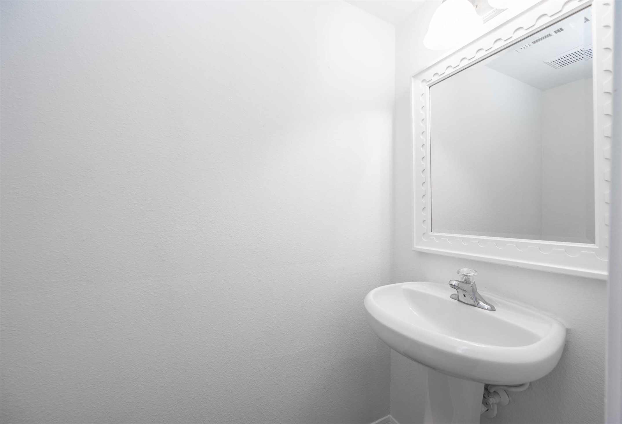 13402 Timber Oak Court Rosharon, TX 77583 - Photo 15 of 34 a bathroom with a sink and a mirror