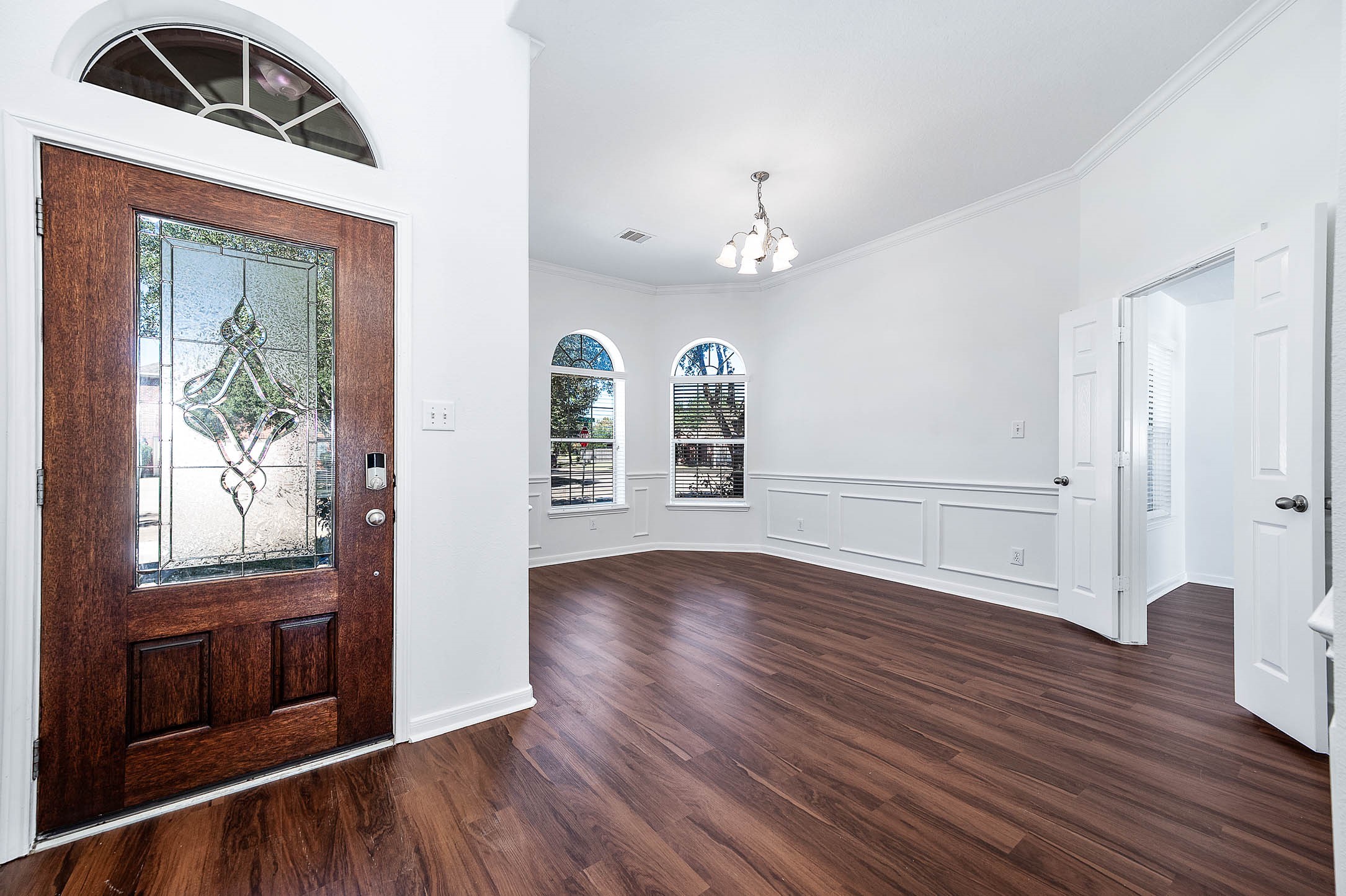 13402 Timber Oak Court Rosharon, TX 77583 - Photo 3 of 34 a view of an empty room with wooden floor and a window
