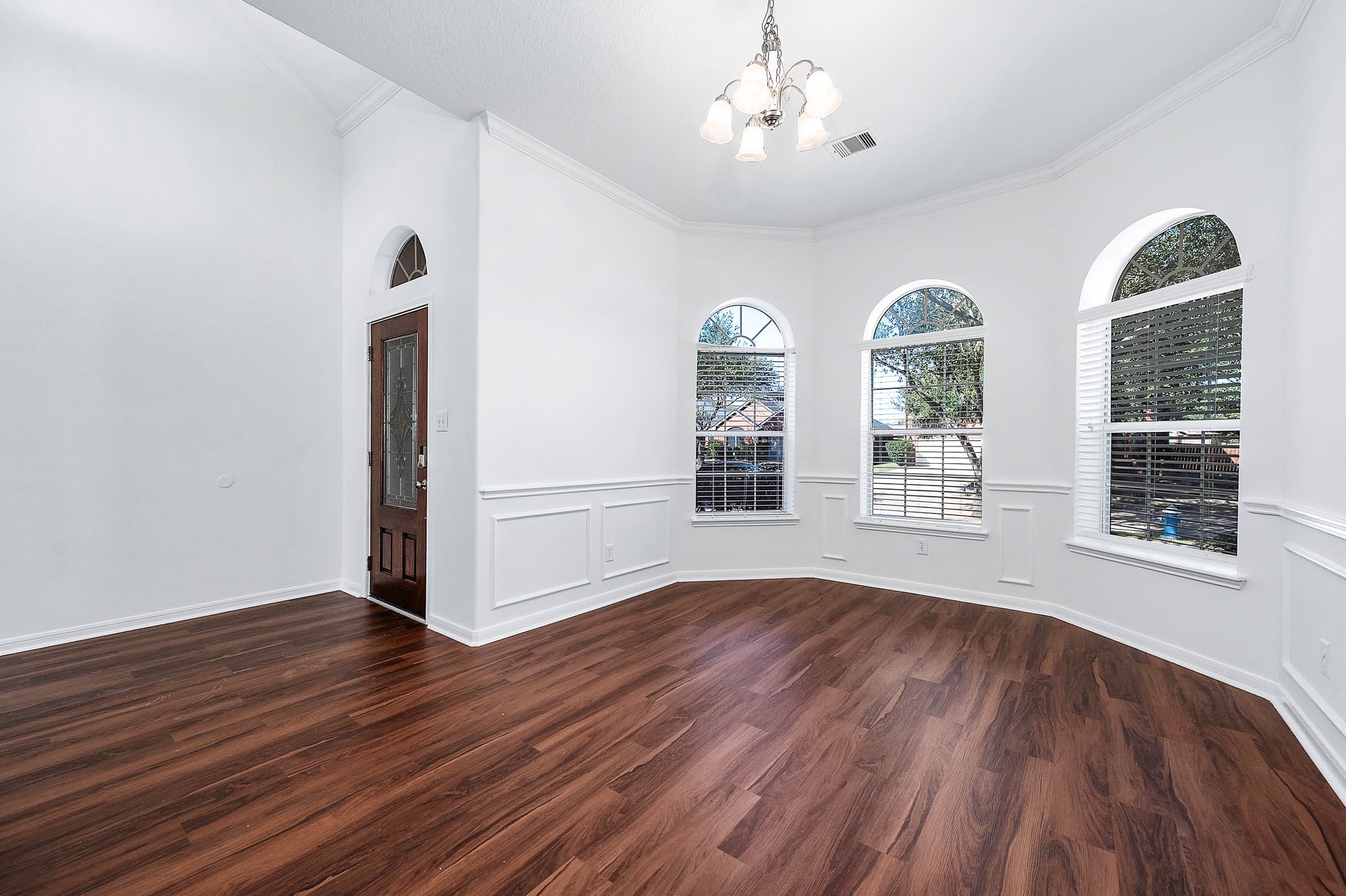 13402 Timber Oak Court Rosharon, TX 77583 - Photo 4 of 34 a view of an empty room with wooden floor and a window