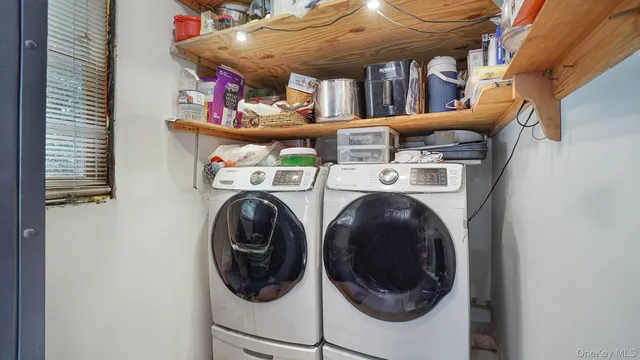 a view of a house with backyard and a tree