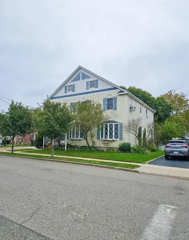 a view of street with houses in background
