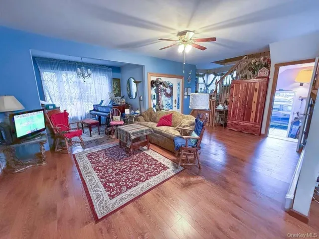 a living room with furniture and a rug