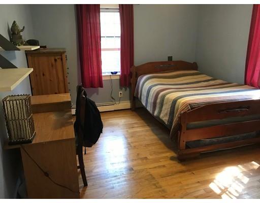 488 Delano Road Marion, MA 02738 - Photo 18 of 24 a bedroom with a bed and wooden floor
