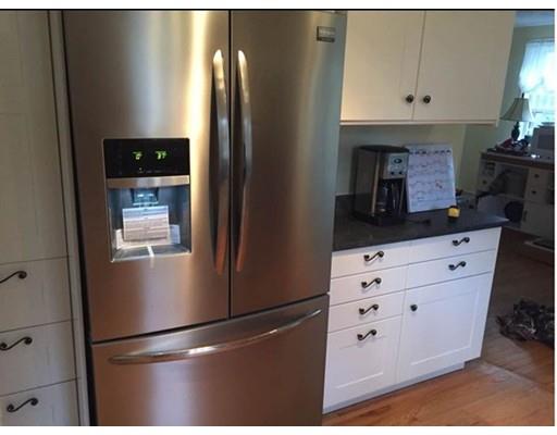 488 Delano Road Marion, MA 02738 - Photo 5 of 24 a kitchen with cabinets and stainless steel appliances