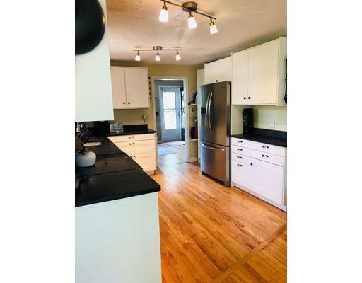 488 Delano Road Marion, MA 02738 - Photo 10 of 24 a kitchen with stainless steel appliances kitchen island granite countertop a refrigerator and a stove